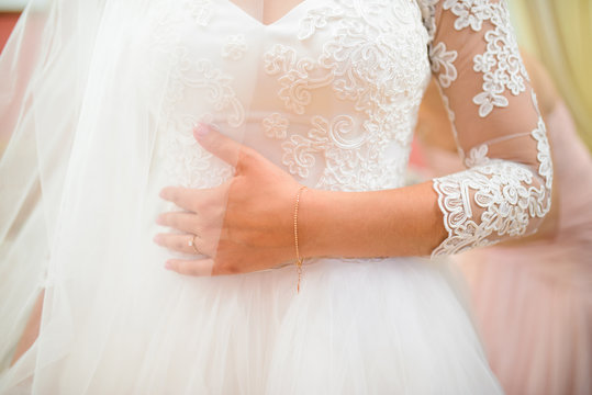 Bride's Hand on Dress
