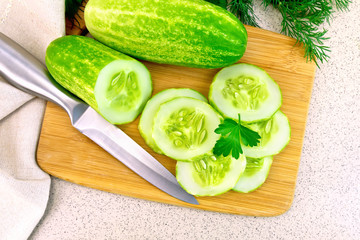 Cucumber with parsley on table top