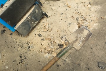 Ash lying near central heating stove in basement