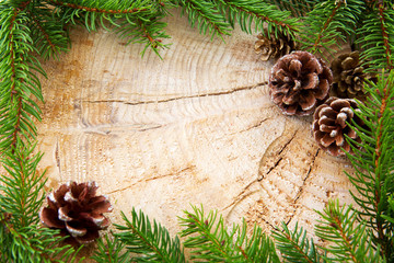 Christmas frame decorated with fir cones and green branches. © Swetlana Wall