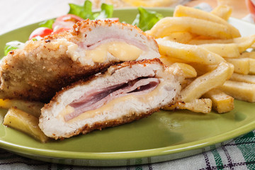 Cutlet Cordon Bleu with pork loin served with French fries and salad