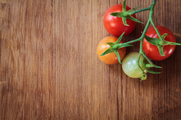 Tomatoes on wood background