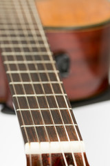 Acoustic guitar neck with frets with blurred background