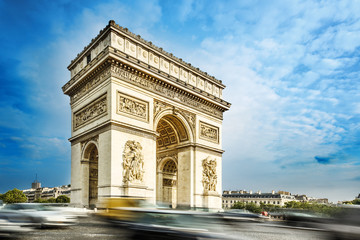 Arc de triomphe, Paris, France, at the blue sky background.