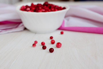 Berries cranberry on white, wood texture