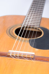 Acoustic guitar bridge with blurred background