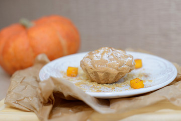 sweet pumpkin muffins with walnuts and powdered suga