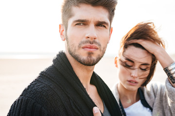Close up portrait of a young couple at the beach