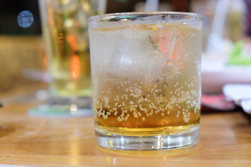 Glass of whiskey with ice