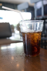 soft drink with ice in takeaway cup