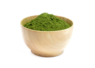 Green tea powder in wood bowl on white background.