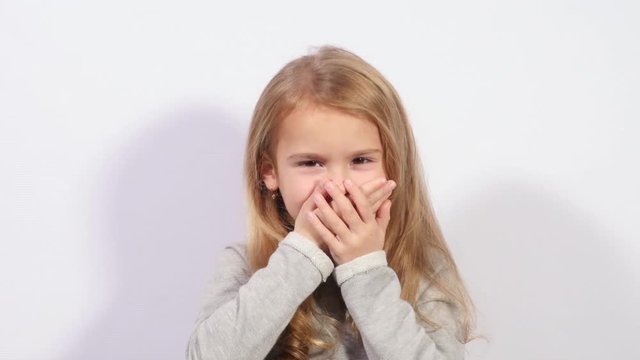 Wise girl. Gesture of three wide monkeys. The girl shows gestures of wisdom.