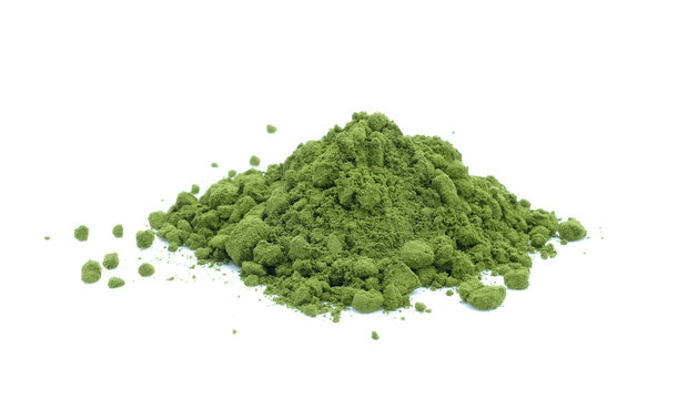 Green tea powder on white background.