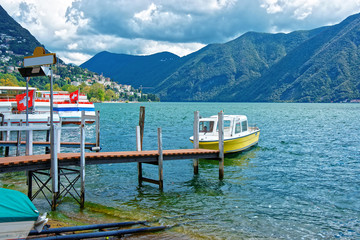 Boat at landing stage in Lugano in Ticino in Switzerland