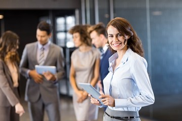 Confident businesswoman looking at camera in office