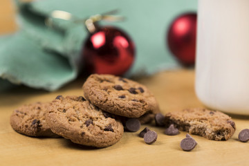 Cookies and Milk for Santa / Cookies and milk with Christmas decoration on a wooden background