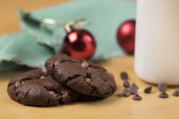 Cookies and Milk for Santa / Cookies and milk with Christmas decoration on a wooden background