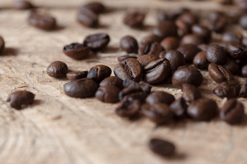 Closeup of coffee beans with focus on one