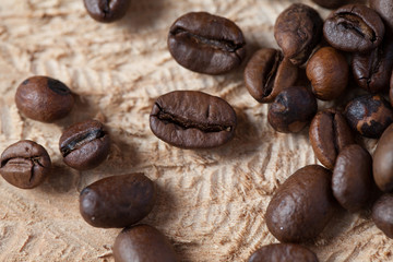 Closeup of coffee beans with focus on one