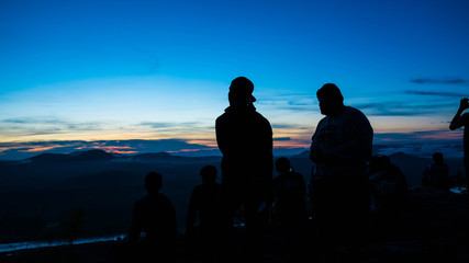 People silhouette in the early morning on mountain