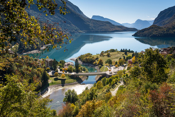 Molveno lake in Dolomites, Italy. Located at the shore of Molveno lake & at the foot Brenta Dolomites group, a popular summer & winter tourists vacation resort
