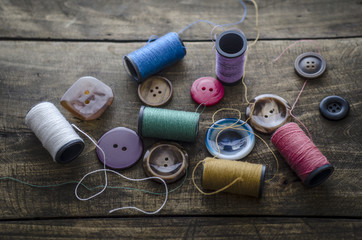 Bobbins with colorful threads and buttons