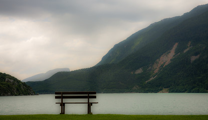 Molveno lake in Dolomites, Italy. Located at the shore of Molveno lake & at the foot Brenta Dolomites group, a popular summer & winter tourists vacation resort
