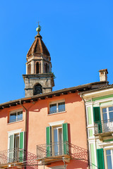 Church tower and colorful architecture in Ascona Ticino Switzerland