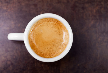 Cup of hot espresso coffee on wood table, espresso brew from ara