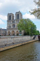 Fototapeta na wymiar Dame de Paris Cathedral and Seine River embankment