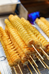 Fried potato chips in Myeongdong open street market in Seoul