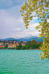 Houses at Lake Lugano and mountains in Ticino Switzerland