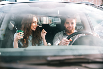 Fashion portrait of couple in car