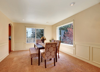 Spacious dining room interior with upholstered bench