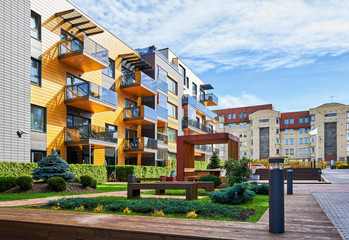 Modern complex of residential buildings with many benches