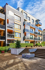 Modern complex of residential buildings with staircase and fountain