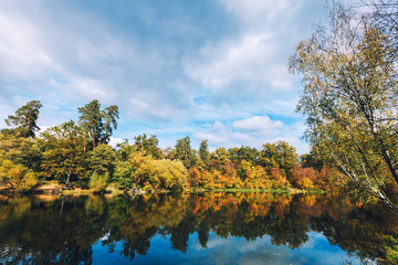 Fototapeta premium Colorful autumn landscape in the lake. Sunrise 