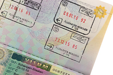 Schengen visa with arrival and departure entry stamp on Thai passport for immigration traveling at...
