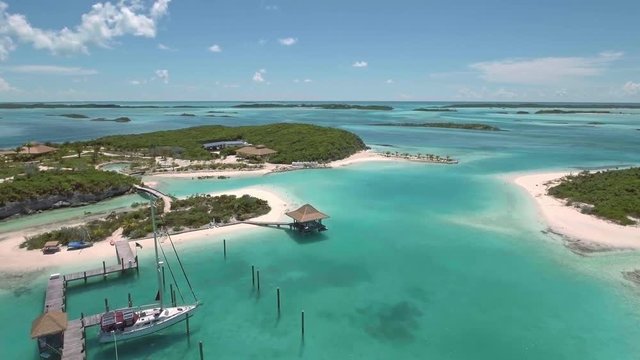 Aerial view of exotic island with buildings and piers for yachts, Exuma, Bahamas