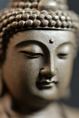 Fototapeta na wymiar The face of the Buddha-style Zen on natural background