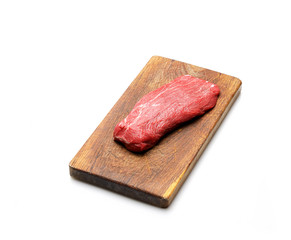 raw beef meat fillet on a cutting board white background.
