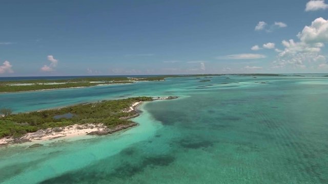 Aerial view of exotic island with buildings and piers for yachts, Exuma, Bahamas