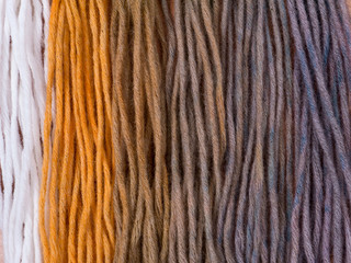 Wool yarn samples colored by henna and indigo