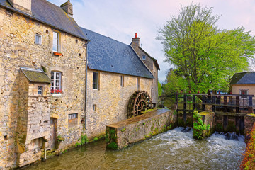 Fototapeta na wymiar Water mill and Aure River in Bayeux at Normandy France
