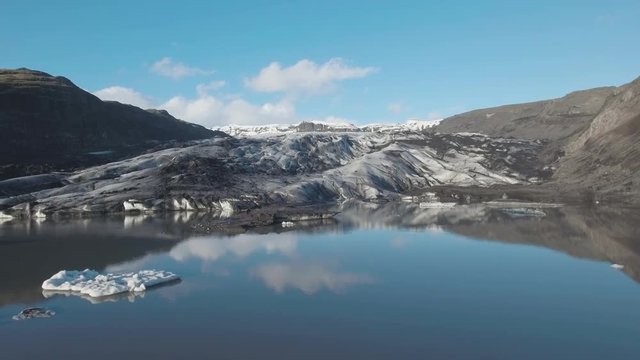 Drone footage of lake and glacier Solheimajokull in Iceland
