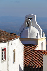 MARVAO, PORTUGAL: Close-up on the whitewashed clock tower