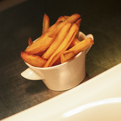 Serving French fries in a pot restaurant