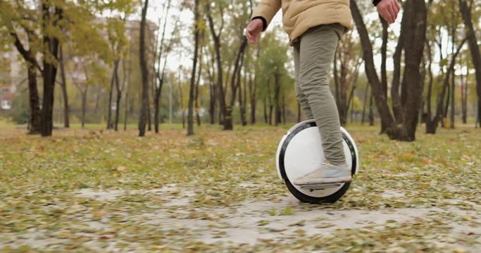 Man legs mono wheel personal electrical transport street outdoor
