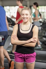 Fototapeta premium Fit woman posing with arms crossed