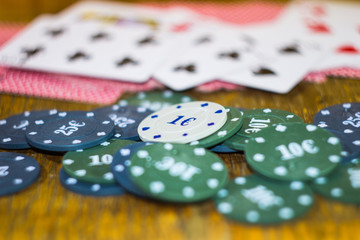 Green, blue chips and cards for poker